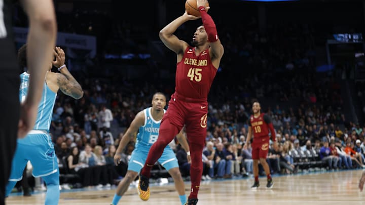 Mar 12, 2023; Charlotte, North Carolina, USA; Cleveland Cavaliers guard Donovan Mitchell (45) attempts a jump shot during the first half against the Charlotte Hornets at Spectrum Center. Mandatory Credit: Brian Westerholt-Imagn Images