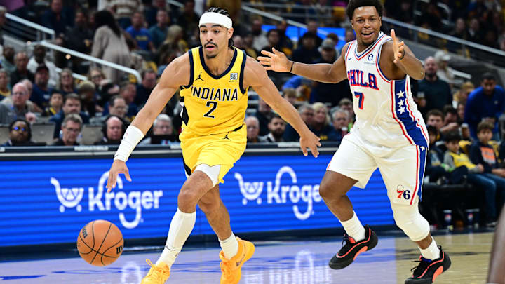 Oct 27, 2024; Indianapolis, Indiana, USA; Indiana Pacers guard Andrew Nembhard (2) runs past Philadelphia 76ers guard Kyle Lowry (7) during the first quarter at Gainbridge Fieldhouse. Mandatory Credit: Marc Lebryk-Imagn Images