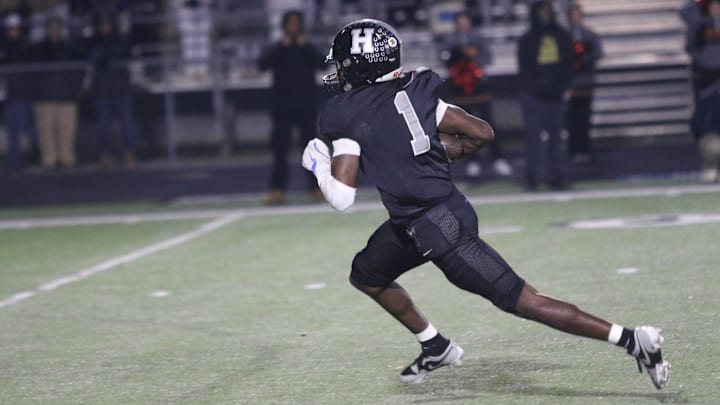 Houston's Andre Allen (1) runs down field after catching a slant pass that he took 33 yards for a touchdown in the third quarter of the Class 6A state semifinal game against Ravenwood during the TSSAA football playoffs Friday, Nov. 29, 2024 in Germantown, Tennessee.