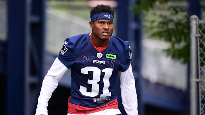 Jul 24, 2024; Foxborough, MA, USA; New England Patriots cornerback Jonathan Jones (31) walks to the practice field during training camp at Gillette Stadium.