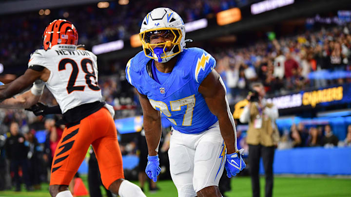 Nov 17, 2024; Inglewood, California, USA; Los Angeles Chargers running back J.K. Dobbins (27) celebrates his touchdown scored against the Cincinnati Bengals during the second half at SoFi Stadium. Mandatory Credit: Gary A. Vasquez-Imagn Images