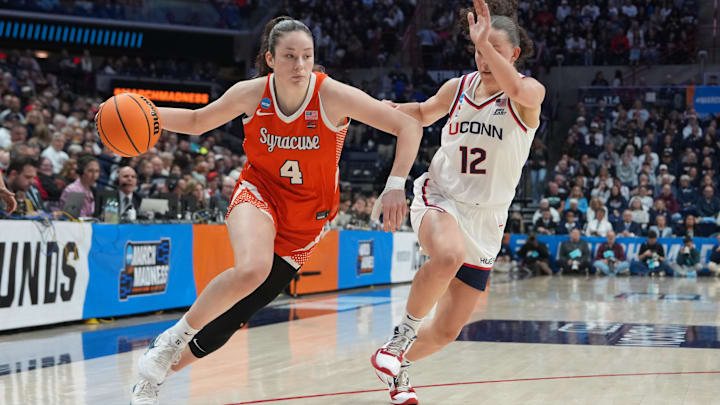 Mar 23, 2026; Storrs, CT, USA; Syracuse Orange guard Sophie Burrow (4) dribbles the ball against UConn Huskies guard Ashlynn Shade (12) during the second half of the second round game of the women’s 2026 NCAA Tournament at Harry A. Gampel Pavilion. Mandatory Credit: Gregory Fisher-Imagn Images