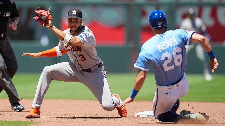 Jun 14, 2026; Kansas City, Missouri, USA; Houston Astros shortstop Jeremy Pena (3) is unable to make the tag as Kansas City Royals center fielder Kameron Misner (26) steals second base during the fourth inning at Kauffman Stadium. Mandatory Credit: Jay Biggerstaff-Imagn Images