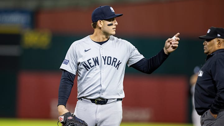 Sep 20, 2024; Oakland, California, USA; New York Yankees first baseman Anthony Rizzo (48) talks to a fan during the seventh inning against the Oakland Athletics at Oakland-Alameda County Coliseum. Mandatory Credit: Bob Kupbens-Imagn Images