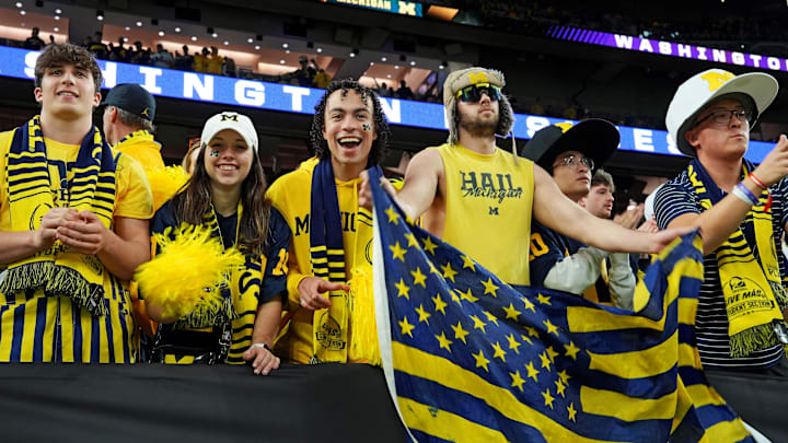 Jan 8, 2024; Houston, TX, USA; Michigan Wolverines fans cheers before the 2024 College Football Playoff national championship game between the Michigan Wolverines and the Washington Huskies at NRG Stadium. Mandatory Credit: Kirby Lee-USA TODAY Sports