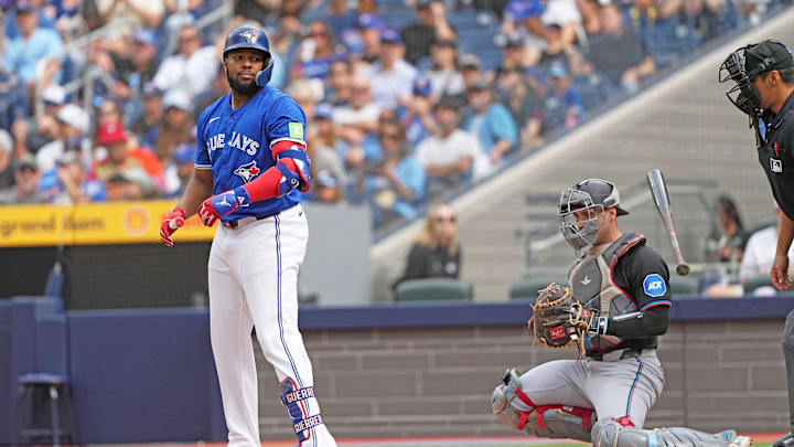 Sep 29, 2024; Toronto, Ontario, CAN; Toronto Blue Jays designated hitter Vladimir Guerrero Jr. (27) flips his bat after being walked against the Miami Marlins during the first inning at Rogers Centre. Mandatory Credit: Nick Turchiaro-Imagn Images Sep 29, 2024; Toronto, Ontario, CAN; Toronto Blue Jays designated hitter Vladimir Guerrero Jr. (27) flips his bat after being walked against the Miami Marlins during the first inning at Rogers Centre. Mandatory Credit: Nick Turchiaro-Imagn Images