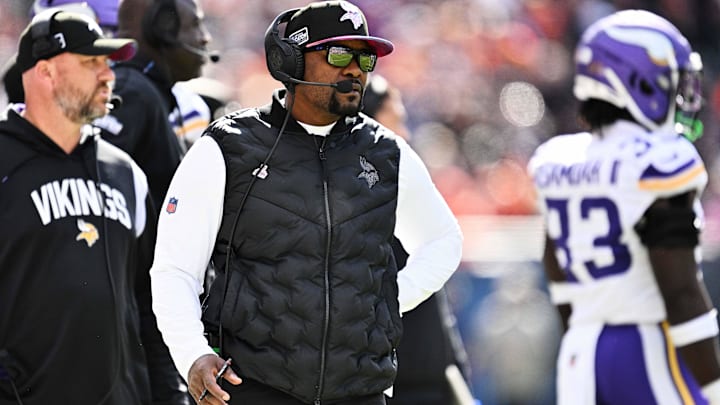 Vikings defensive coordinator Brian Flores watches his team play against the Bears  at Soldier Field.
