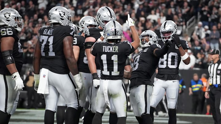 Dec 22, 2024; Paradise, Nevada, USA; Las Vegas Raiders running back Ameer Abdullah (8) celebrates with wide receiver Tre Tucker (11) and wide receiver Terrace Marshall Jr. (80) after scoring on a 7-yard touchdown run in the second half against the Jacksonville Jaguars at Allegiant Stadium. Mandatory Credit: Kirby Lee-Imagn Images