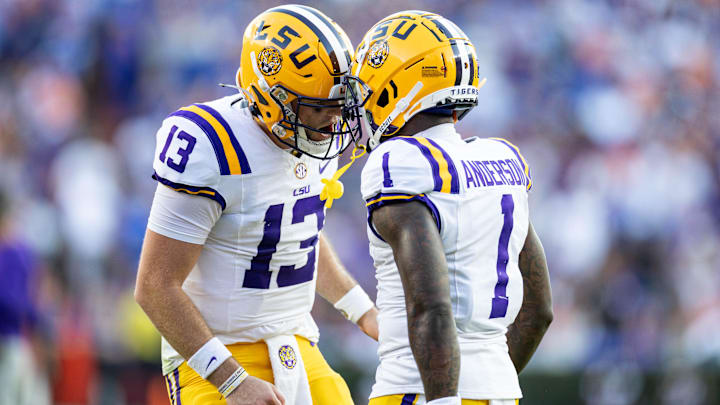 Nov 16, 2024; Gainesville, Florida, USA; LSU Tigers quarterback Garrett Nussmeier (13) celebrates with wide receiver Aaron Anderson (1) after a touchdown against the Florida Gators during the first half at Ben Hill Griffin Stadium. Mandatory Credit: Matt Pendleton-Imagn Images