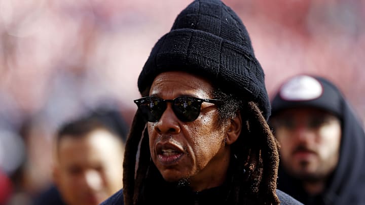 Jay-Z walks on the field before a game