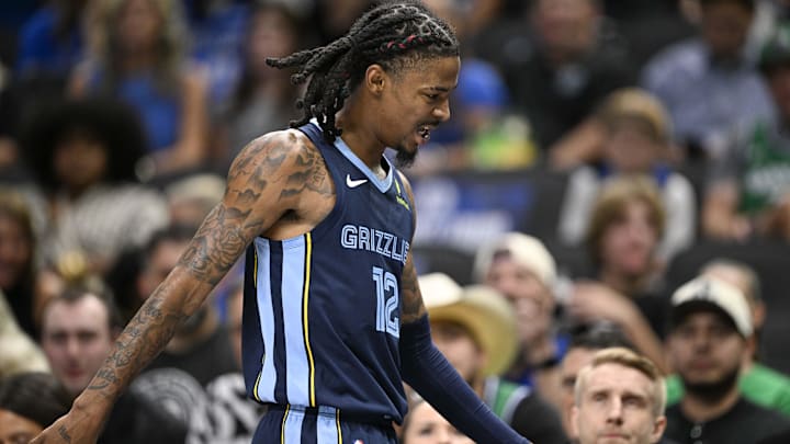 Oct 7, 2024; Dallas, Texas, USA; Memphis Grizzlies guard Ja Morant (12) walks off the court after he appears to suffer another lower body injury during the second half against the Dallas Mavericks at the American Airlines Center. Mandatory Credit: Jerome Miron-Imagn Images