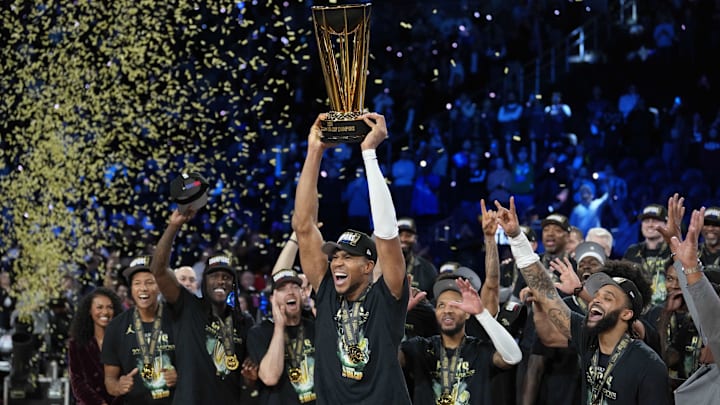 Dec 17, 2024; Las Vegas, Nevada, USA; Milwaukee Bucks forward Giannis Antetokounmpo (34) celebrates with the trophy and teammates after winning the Emirates NBA Cup championship game against the Oklahoma City Thunder at T-Mobile Arena. Mandatory Credit: Kyle Terada-Imagn Images