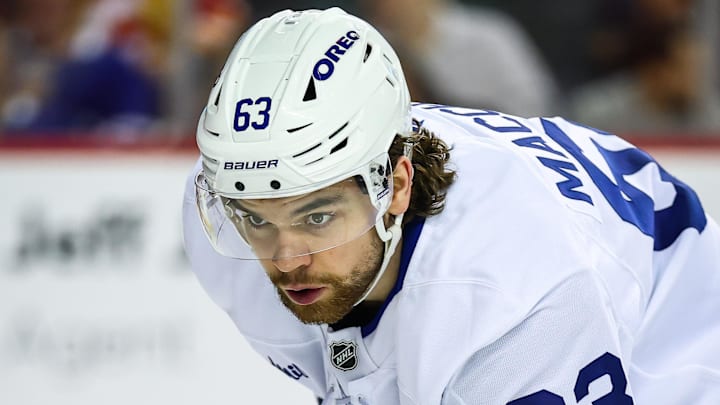Feb 2, 2026; Calgary, Alberta, CAN; Toronto Maple Leafs left wing Matias MacCelli (63) during the face off against the Calgary Flames during the third period at Scotiabank Saddledome. Mandatory Credit: Sergei Belski-Imagn Images