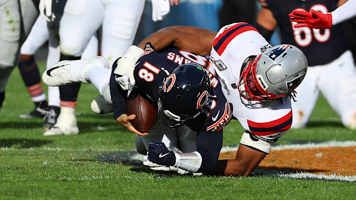 Caleb Williams is knocked down for a sack by Deatrich Wise during Sunday's Bears loss. Williams took nine sacks in the game. Caleb Williams is knocked down for a sack by Deatrich Wise during Sunday's Bears loss. Williams took nine sacks in the game.