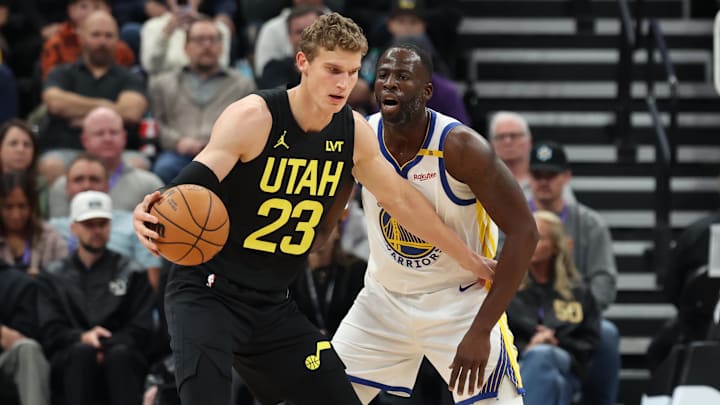 Oct 25, 2024; Salt Lake City, Utah, USA; Utah Jazz forward Lauri Markkanen (23) posts up on Golden State Warriors forward Draymond Green (23) during the first quarter at Delta Center. Mandatory Credit: Rob Gray-Imagn Images