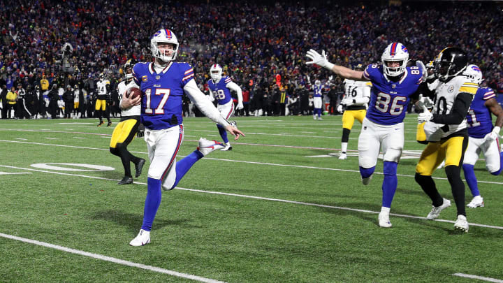 Buffalo Bills quarterback Josh Allen (17) runs into the end zone on this 52 yard run.