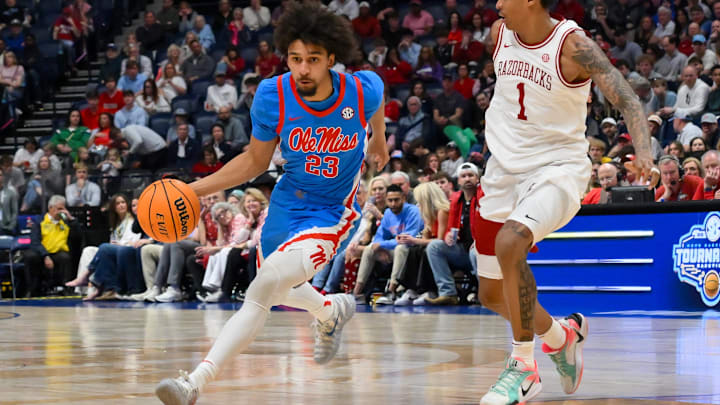 Mar 14, 2026; Nashville, TN, USA; Mississippi Rebels guard Patton Pinkins (23) drives to the basket past Arkansas Razorbacks guard Meleek Thomas (1) during the second half at Bridgestone Arena. Mandatory Credit: Steve Roberts-Imagn Images Mar 14, 2026; Nashville, TN, USA; Mississippi Rebels guard Patton Pinkins (23) drives to the basket past Arkansas Razorbacks guard Meleek Thomas (1) during the second half at Bridgestone Arena. Mandatory Credit: Steve Roberts-Imagn Images