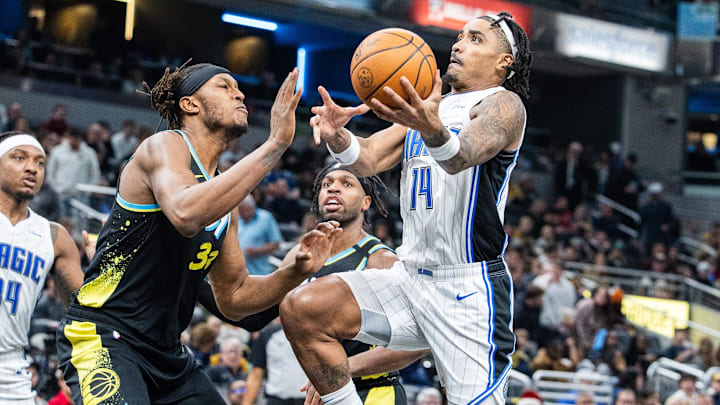 Dec 23, 2023; Indianapolis, Indiana, USA: Orlando Magic guard Gary Harris (14) shoots the ball while Indiana Pacers center Myles Turner (33) defends in the second half at Gainbridge Fieldhouse. Mandatory Credit: Trevor Ruszkowski-Imagn Images Dec 23, 2023; Indianapolis, Indiana, USA: Orlando Magic guard Gary Harris (14) shoots the ball while Indiana Pacers center Myles Turner (33) defends in the second half at Gainbridge Fieldhouse. Mandatory Credit: Trevor Ruszkowski-Imagn Images