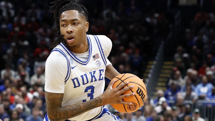 Isaiah Evans holds the basketball.