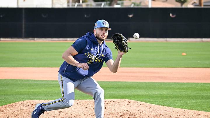 Milwaukee Brewers pitcher Peter Strzelecki fields a ball during spring training workouts Sunday, February 15, 2026, at American Family Fields of Phoenix in Phoenix, Arizona. Milwaukee Brewers pitcher Peter Strzelecki fields a ball during spring training workouts Sunday, February 15, 2026, at American Family Fields of Phoenix in Phoenix, Arizona.
