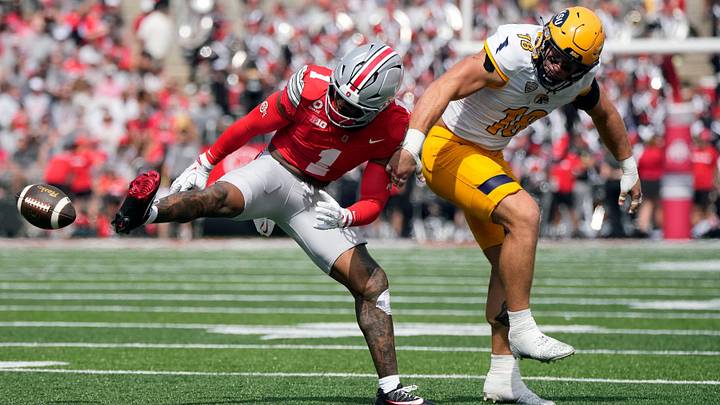 Ohio State Buckeyes safety Earl Little Jr. (1) knocks the ball away from Kent State Golden Flashes tight end Hunter Hopperton (18) in the second quarter of the NCAA football game at Ohio Stadium on Sept. 19, 2026.