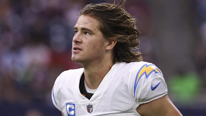 Dec 26, 2021; Houston, Texas, USA; Los Angeles Chargers quarterback Justin Herbert (10) jogs off the field during the game against the Houston Texans at NRG Stadium. Mandatory Credit: Troy Taormina-Imagn Images