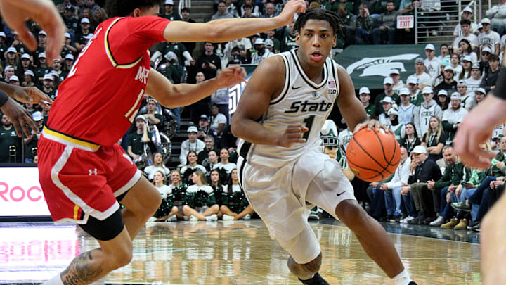 Jan 24, 2026; East Lansing, Michigan, USA;  Michigan State Spartans guard Jeremy Fears Jr. (1) drives past Maryland Terrapins guard Isaiah Watts (12) during the second half at Jack Breslin Student Events Center. Mandatory Credit: Dale Young-Imagn Images