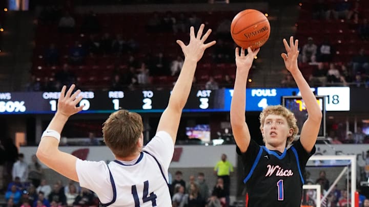 Wisconsin Lutheran's Kager Knueppel (1) elevates for a shot over Appleton North's Ben Zdzieblowski (14) during their WIAA Division 1 state semifinal basketball game on Friday, March 20, 2026, at the Kohl Center in Madison, Wisconsin.