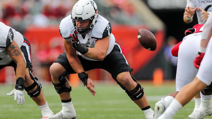 Sep 17, 2022; Cincinnati, Ohio, USA; Cincinnati Bearcats offensive lineman Gavin Gerhardt (53) snaps the ball against the Miami Redhawks in the second half at Paycor Stadium. Mandatory Credit: Katie Stratman-Imagn Images