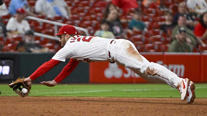 Sep 18, 2024; St. Louis, Missouri, USA;  St. Louis Cardinals third baseman Nolan Arenado (28) dives but is unable to field a ground ball hit by Pittsburgh Pirates center fielder Billy Cook (not pictured) during the ninth inning at Busch Stadium. Mandatory Credit: Jeff Curry-Imagn Images
