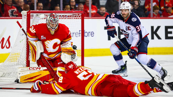 Nov 5, 2025; Calgary, Alberta, CAN; Calgary Flames goaltender Dustin Wolf (32) guards his net against the Columbus Blue Jackets during the third period at Scotiabank Saddledome. Mandatory Credit: Sergei Belski-Imagn Images