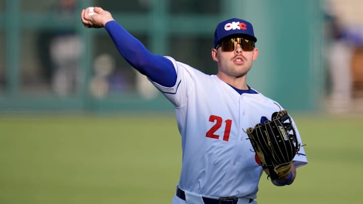 Oklahoma City's Dalton Rushing (21) warms up before a baseball game between the Oklahoma City Baseball Club and the Round Rock Express at the Chickasaw Bricktown Ballpark in Oklahoma City, Wednesday, Aug. 7, 2024.
