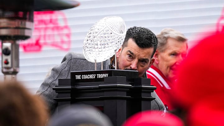 Ohio State Buckeyes head coach Ryan Day makes sure the Coaches’ Trophy is put back on the stand during Ohio State's national championship celebration at Ohio Stadium on Sunday, Jan. 26, 2025 in Columbus, Ohio.