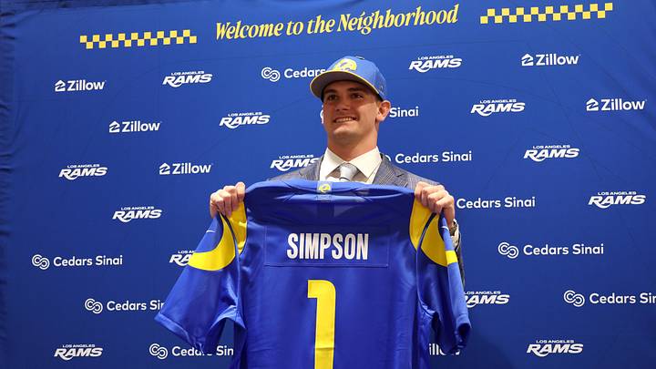 Apr 24, 2026; Inglewood, CA, USA;  Los Angeles Rams first-round draft pick Ty Simpson poses with his jersey during a press conference at Code Next at Hollywood Park. Mandatory Credit: Kiyoshi Mio-Imagn Images