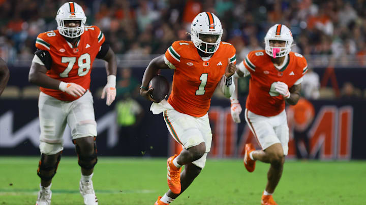 Sep 27, 2024; Miami Gardens, Florida, USA; Miami Hurricanes quarterback Cam Ward (1) runs with the football against the Virginia Tech Hokies during the third quarter at Hard Rock Stadium. Mandatory Credit: Sam Navarro-Imagn Images