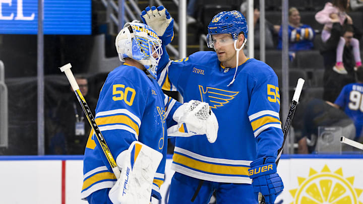 Oct 2, 2025; St. Louis, Missouri, USA; St. Louis Blues goaltender Jordan Binnington (50) celebrates with defenseman Colton Parayko (55) after the Blues defeated the Ottawa Senators at Enterprise Center. Mandatory Credit: Jeff Curry-Imagn Images