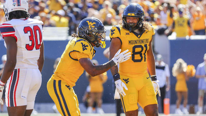 Aug 30, 2025; Morgantown, West Virginia, USA; West Virginia Mountaineers running back Jahiem White (1) celebrates after scoring a touchdown during the third quarter against the Robert Morris Colonials at Milan Puskar Stadium. Mandatory Credit: Ben Queen-Imagn Images