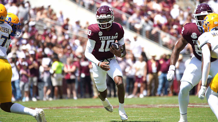 Sep 7, 2024; College Station, Texas, USA; Texas A&M Aggies quarterback Marcel Reed (10) runs the ball against the McNeese State Cowboys during the second quarter at Kyle Field. Sep 7, 2024; College Station, Texas, USA; Texas A&M Aggies quarterback Marcel Reed (10) runs the ball against the McNeese State Cowboys during the second quarter at Kyle Field.