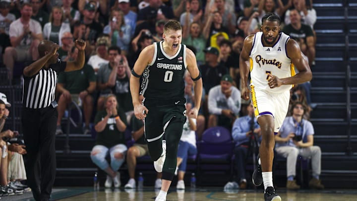 Nov 25, 2025; Fort Myers, Florida, USA; Michigan State Spartans forward Jaxon Kohler (0) reacts after a basket against the East Carolina Pirates in the first half at Suncoast Credit Union Arena. Mandatory Credit: Nathan Ray Seebeck-Imagn Images Nov 25, 2025; Fort Myers, Florida, USA; Michigan State Spartans forward Jaxon Kohler (0) reacts after a basket against the East Carolina Pirates in the first half at Suncoast Credit Union Arena. Mandatory Credit: Nathan Ray Seebeck-Imagn Images