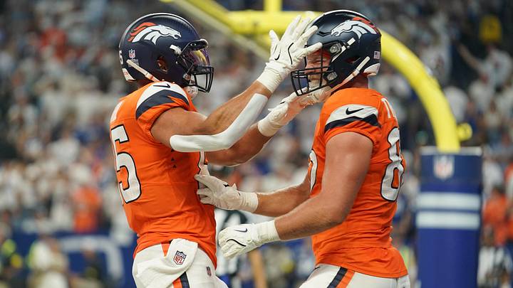Sep 14, 2025; Indianapolis, Indiana, USA; Denver Broncos tight end Adam Trautman (82) celebrates scoring a touchdown with tight end Lucas Krull (85) during the second quarter  at Lucas Oil Stadium. Mandatory Credit: Robert Goddin-Imagn Images