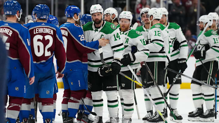 May 17, 2024; Denver, Colorado, USA; Dallas Stars left wing Jamie Benn (14) and Colorado Avalanche center Nathan MacKinnon (29) greet each other following a double overtime period in game six of the second round of the 2024 Stanley Cup Playoffs at Ball Arena. Mandatory Credit: Ron Chenoy-Imagn Images