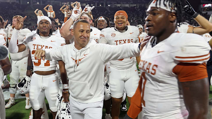 Oct 25, 2025; Starkville, Mississippi, USA; Texas Longhorns head coach Steve Sarkisian reacts with defensive linemen Colin Simmons (1) after beating the Mississippi State Bulldogs in overtime at Davis Wade Stadium at Scott Field. Mandatory Credit: Petre Thomas-Imagn Images Oct 25, 2025; Starkville, Mississippi, USA; Texas Longhorns head coach Steve Sarkisian reacts with defensive linemen Colin Simmons (1) after beating the Mississippi State Bulldogs in overtime at Davis Wade Stadium at Scott Field. Mandatory Credit: Petre Thomas-Imagn Images