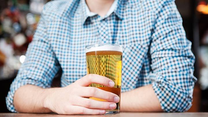 A person drinking beer
