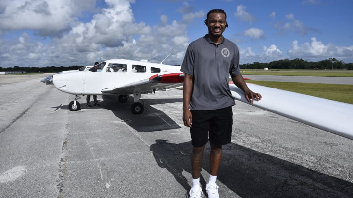 Orlando Magic center Wendell Carter Jr. poses by a plane at his "Flight 34" event on Thursday at Orlando Sanford International Airport. Orlando Magic center Wendell Carter Jr. poses by a plane at his "Flight 34" event on Thursday at Orlando Sanford International Airport.