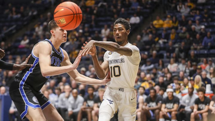 Feb 11, 2025; Morgantown, West Virginia, USA; West Virginia Mountaineers guard Sencire Harris (10) passes the ball during the first half against the Brigham Young Cougars at WVU Coliseum. Mandatory Credit: Ben Queen-Imagn Images