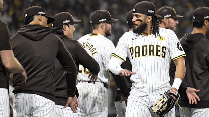 Oct 8, 2024; San Diego, California, USA; San Diego Padres outfielder Fernando Tatis Jr. (23) celebrates with teammates after defeating the Los Angeles Dodgers during game three of the NLDS for the 2024 MLB Playoffs at Petco Park. Mandatory Credit: Denis Poroy-Imagn Images Oct 8, 2024; San Diego, California, USA; San Diego Padres outfielder Fernando Tatis Jr. (23) celebrates with teammates after defeating the Los Angeles Dodgers during game three of the NLDS for the 2024 MLB Playoffs at Petco Park. Mandatory Credit: Denis Poroy-Imagn Images