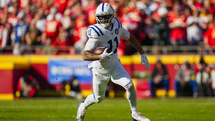 Nov 23, 2025; Kansas City, Missouri, USA; Indianapolis Colts wide receiver Michael Pittman Jr. (11) runs with the ball during the first half against the Kansas City Chiefs at GEHA Field at Arrowhead Stadium. Mandatory Credit: Jay Biggerstaff-Imagn Images