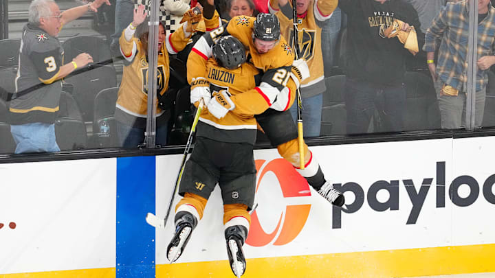 Apr 29, 2026; Las Vegas, Nevada, USA; Vegas Golden Knights center Brett Howden (21) celebrates with Vegas Golden Knights defenseman Jeremy Lauzon (5) after scoring a game winning goal against the Utah Mammoth during the second overtime period of game five of the first round of the 2026 Stanley Cup Playoffs at T-Mobile Arena. Mandatory Credit: Stephen R. Sylvanie-Imagn Images