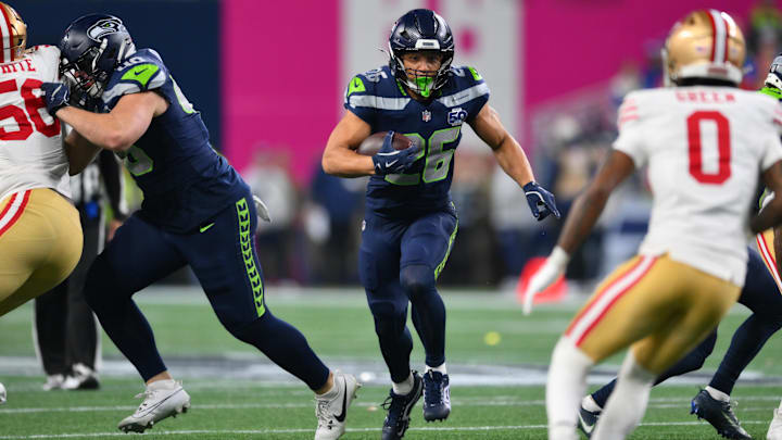 Seattle Seahawks running back Zach Charbonnet (26) carries the ball against the San Francisco 49ers.
