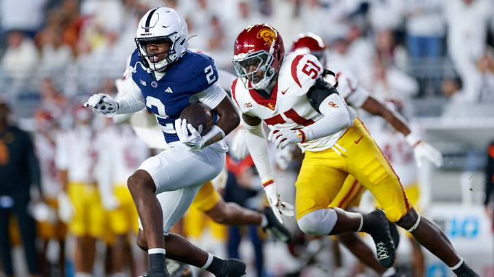 Zay Robinson running away from a USC defender in his first White Out Zay Robinson running away from a USC defender in his first White Out